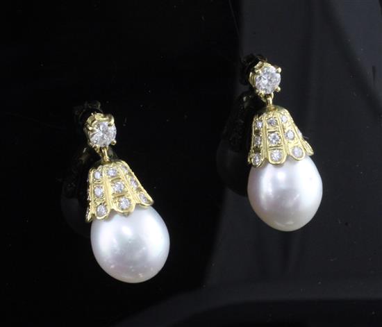 A pair of 18ct gold, diamond and South Sea pearl drop earrings, drop 0.75in.